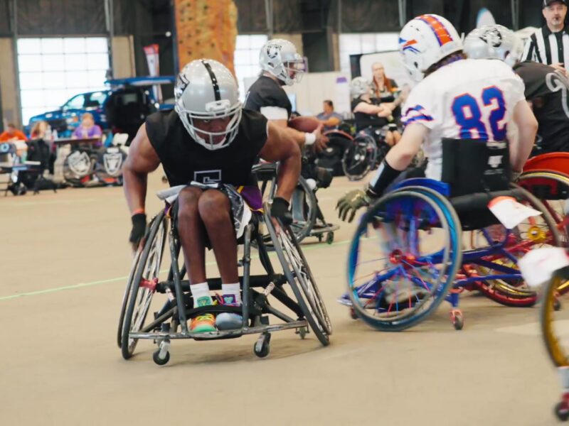 Wheelchair football players competing in a Move United game