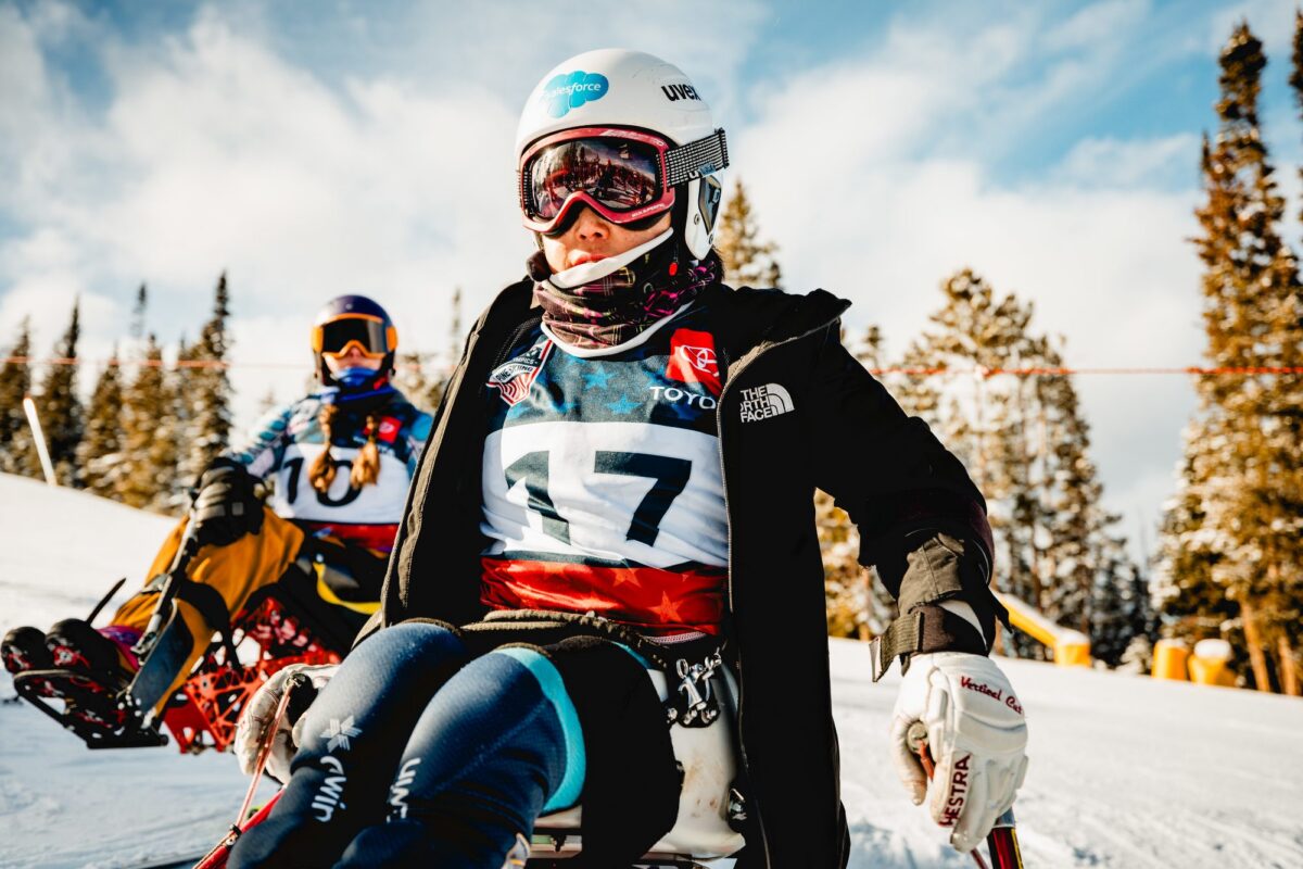 A sit-skier in bib 17 at the start of an NSCD race